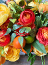 Citrus & Ranunculus Floral Arrangement for Summer